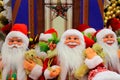 Funny red Santa Claus, a lot of favorite beautiful New Year and Christmas toys, many decorations and gifts, the best positive