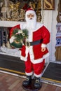 Monte-Carlo, Monaco 29.11.2020 Funny red Santa Claus and beautiful Christmas toys in the showcase, many decorations and