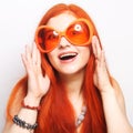 Funny redhair woman in big orange glasses