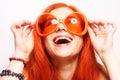 Funny redhair woman in big orange glasses