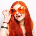 Funny redhair woman in big orange glasses