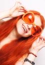 Funny redhair woman in big orange glasses