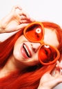 Funny redhair woman in big orange glasses