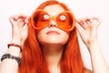 Funny redhair woman in big orange glasses