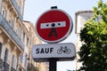 funny road no entry sign customized with an icon of a prisoner man in french city street