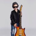 Funny rock child with guitar.fashionable little boy Royalty Free Stock Photo