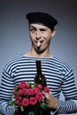 Funny romantic sailor man opening bottle