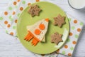 Funny sandwich with cheese and carrots in a shape of rocket and stars, meal for kids idea