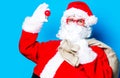 Funny Santa Claus have a fun with light bulb Royalty Free Stock Photo