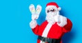 Funny Santa Claus have a fun with vacation flip flops Royalty Free Stock Photo