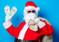 Funny Santa Claus have a fun with vacation flip flops Royalty Free Stock Photo