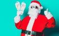 Funny Santa Claus have a fun with vacation flip flops Royalty Free Stock Photo