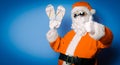 Funny Santa Claus have a fun with vacation flip flops Royalty Free Stock Photo