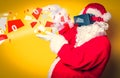 Funny Santa Claus have a joy with VR glasses Royalty Free Stock Photo