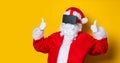 Funny Santa Claus have a joy with VR glasses Royalty Free Stock Photo