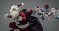 Santa Claus running and delivering gifts Royalty Free Stock Photo