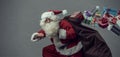 Santa Claus running and delivering gifts Royalty Free Stock Photo