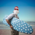 Funny santa claus surfer beach Royalty Free Stock Photo