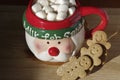 hot chocolate Santa Clause cute mug with marshmallows, and gingerbread cookies on wooden table Royalty Free Stock Photo