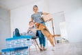 Funny scene with beagle dog - family move in new apartment Royalty Free Stock Photo