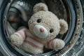 Funny Scene: Plush Bear Inside Washing Machine Window Royalty Free Stock Photo