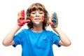 funny schoolboy showing painted hands with smiley icons Royalty Free Stock Photo