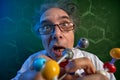 Funny scientist with model molecules