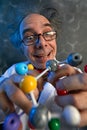 Funny scientist holding structure of model molecules Royalty Free Stock Photo