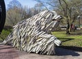 Funny sculpture of a large white furry dog.