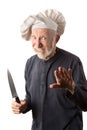 Funny senior chef with knife