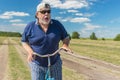 Funny senior shows his fear to ride on a bicycle