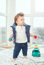 Funny serious baby toddler boy at home Royalty Free Stock Photo