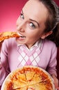 Funny shot of pretty woman eating pizza
