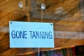 Funny sign: gone tanning