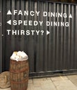 Funny Sign directing people to different types of dining experiences in London England