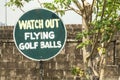 Funny sign Watch out, flying golf balls in the golf course