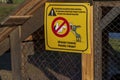 Funny signboard on Belarus and English languages placed in the zoo. Humor