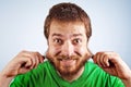 Funny silly man grabbing his hairy beard Royalty Free Stock Photo