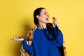 Portrait of Caucasian young woman flu and cold, feeling sick posing isolated on yellow studio background. Royalty Free Stock Photo