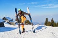 Funny skier mimics putting his skis on wrong, vertically. Location: Poiana Brasov ski resort, Romania