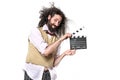 Funny, skinny geek holding a clappenboard - isolated