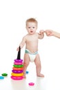 Funny small baby standing with help of mother Royalty Free Stock Photo