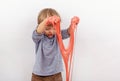 Funny small boy playing with slime