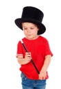 Funny small magician with a top hat and a magic wand Royalty Free Stock Photo