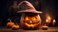 Funny Smiley pumpkin glowing inside with a green witch hat - Halloween Theme Royalty Free Stock Photo