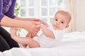 Funny smiling baby gymnastic practice with mother Royalty Free Stock Photo