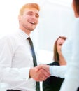 Funny smiling businessman shaking hands with his partner. Royalty Free Stock Photo