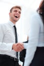 Funny smiling businessman shaking hands with his partner. Royalty Free Stock Photo