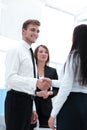 Funny smiling businessman shaking hands with his partner. Royalty Free Stock Photo