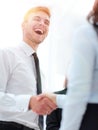 Funny smiling businessman shaking hands with his partner. Royalty Free Stock Photo